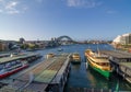 Circular quay wharf with the view of Sydney harbour bridge. Royalty Free Stock Photo